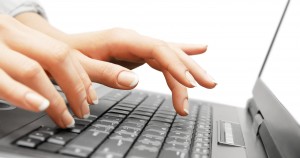 image of female hands typing