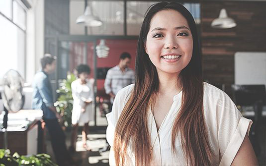 Woman in workplace smiling